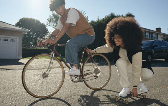 Young woman and men wearing Reebok Classic clothing and shoes